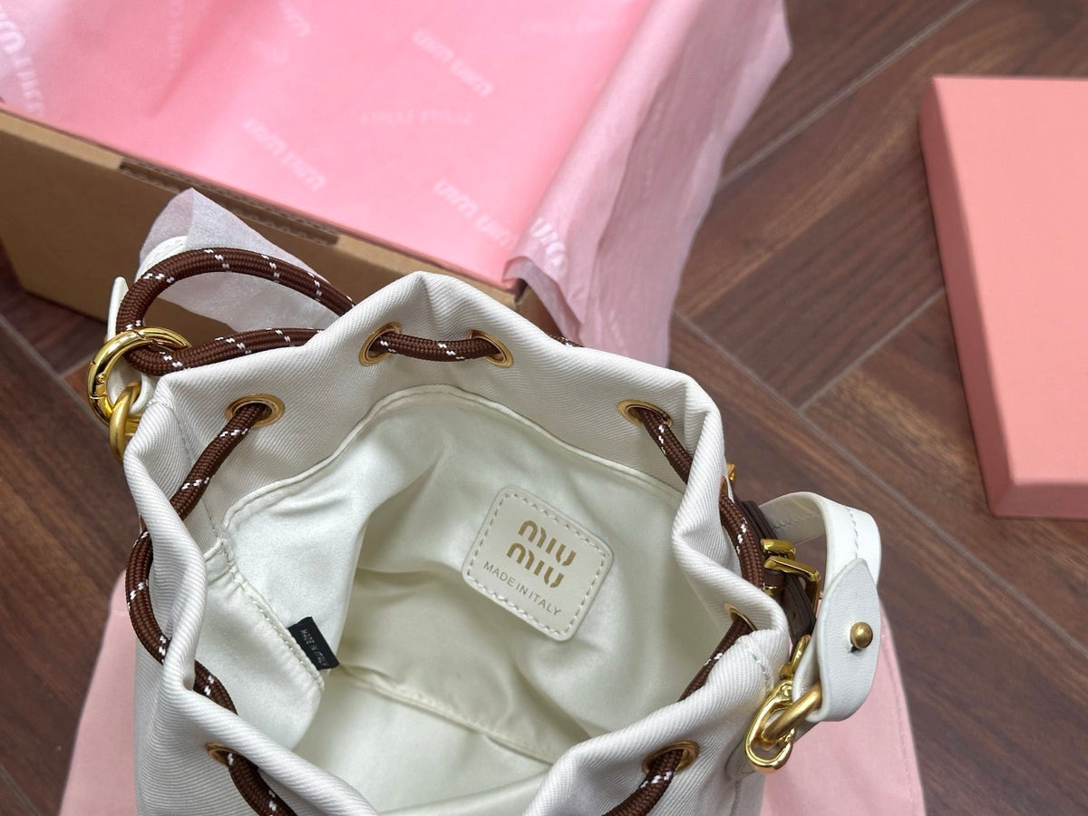 DRAWSTRING BUCKET BAG 21 IN WHITE CANVAS GOLD HARDWARE