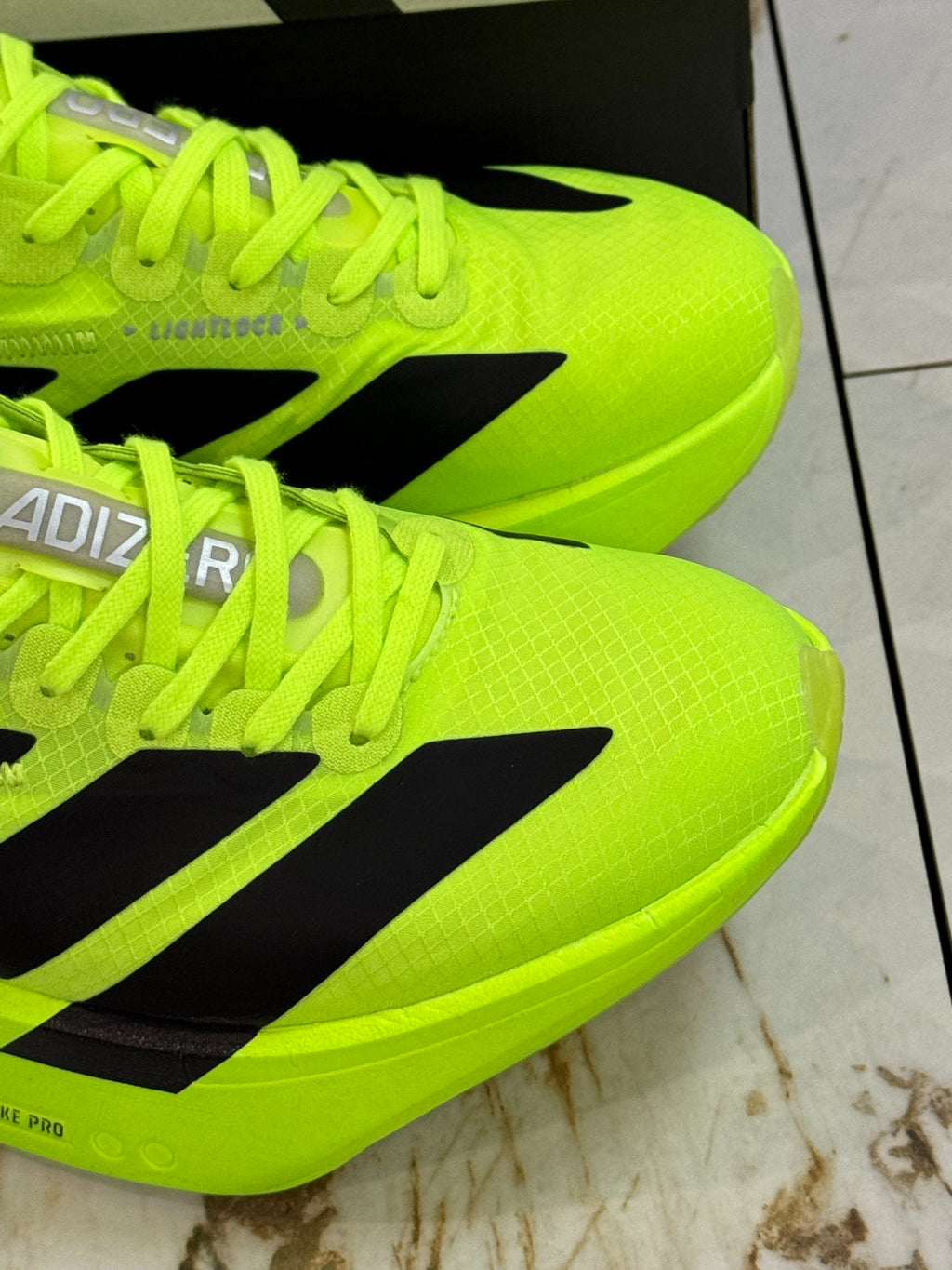 adidas Adizero Adios Pro 4 Running Shoes - Solar Yellow / Core Black